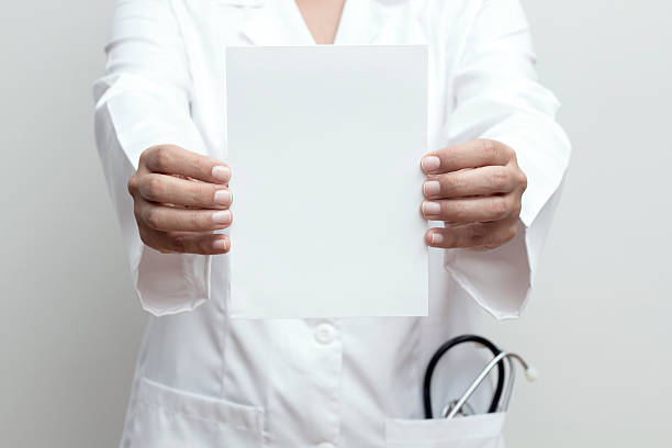istock Doctor Holding a Blank Sign 496484744