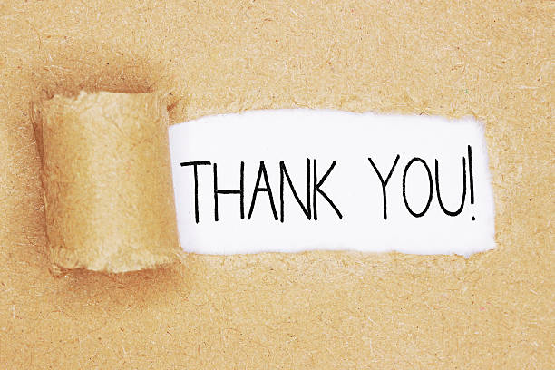istock Torn brown paper with the words 