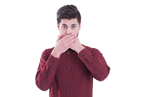 istock Young man covering his mouth with his hand 496489300