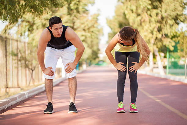 istock Couple tired after running together 496490070