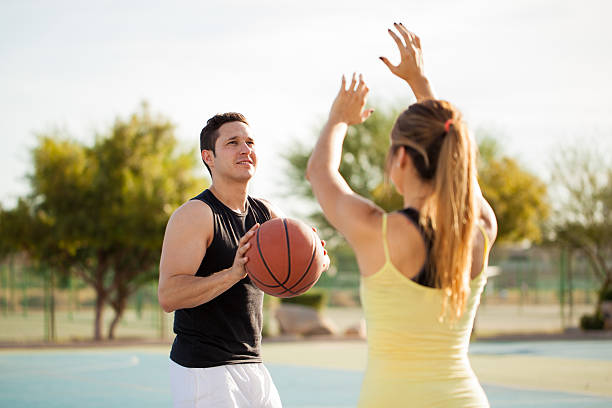 istock Cute couple playing basketball 496491034