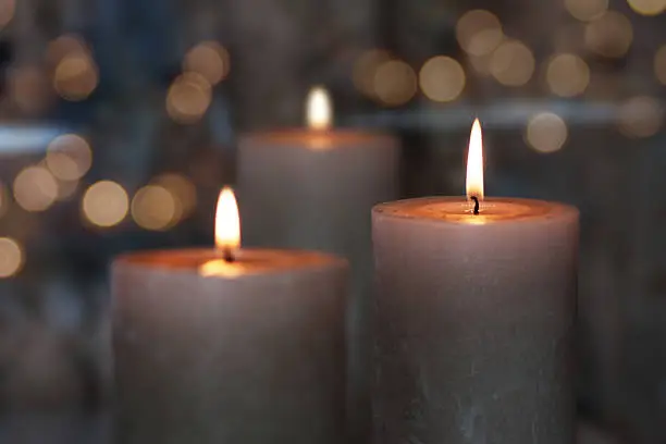 Lots of candles on dark background