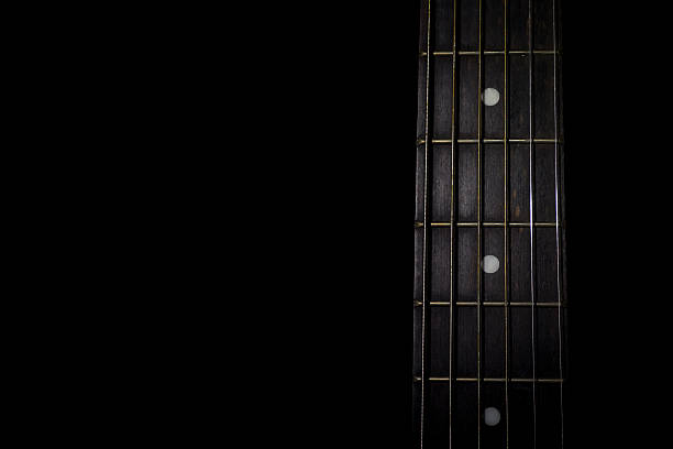 istock guitar neck isolated on black background 496492946