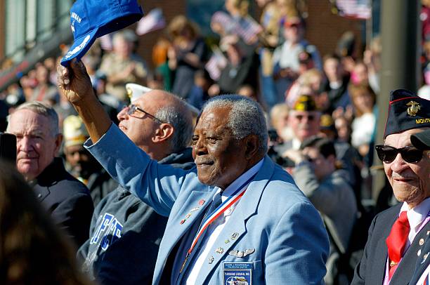 Inaugural Philly Veterans Parade Philadelphia, PA, USA - November 8, 2015: Tuskegee Airmen Eugene J. Richardson, Jr. is acknowledged, omens other Veterans of different wars during the November 8, 2015 inaugural Philly Veterans Parade in Center City Philadelphia, PA. (photo by Bastiaan Slabbers) military parade stock pictures, royalty-free photos & images