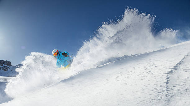 istock Skier skiing downhill in high mountains 496512478