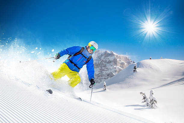 istock Skier skiing downhill in high mountains 496512628