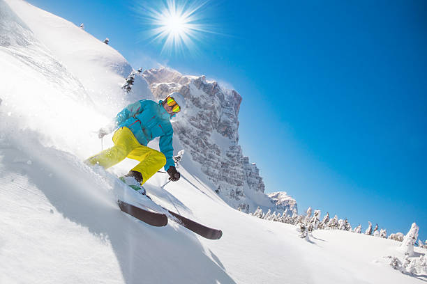 istock Skier skiing downhill in high mountains 496512690