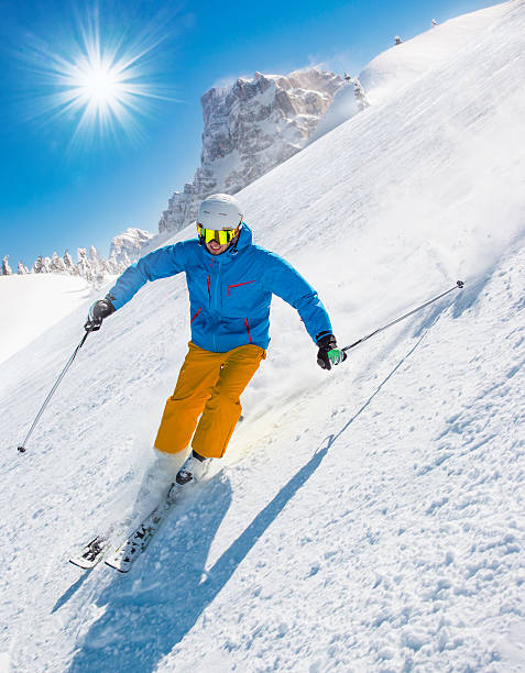 istock Skier skiing downhill in high mountains 496512710