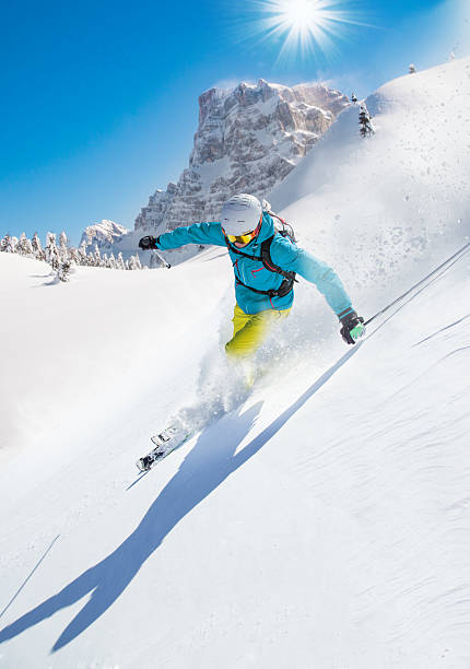 istock Skier skiing downhill in high mountains 496512842