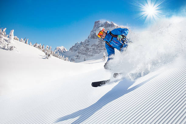 istock Skier skiing downhill in high mountains 496512902
