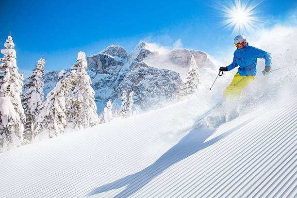 istock Skier skiing downhill in high mountains 496513112