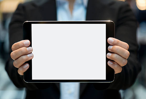istock Businesswoman showing touchpad 496513518