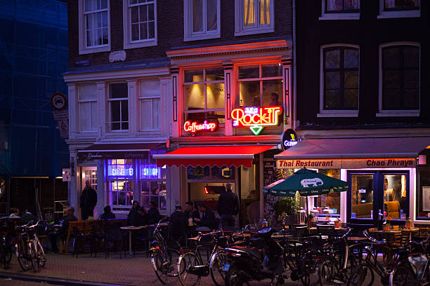 AMSTERDAM, NETHERLANDS - JUNE 25, 2017: Storefronts of the Ice Bakery cafe and Argentinean steakhouse restaurant on the Paleisstraat street in the center of Amsterdam.