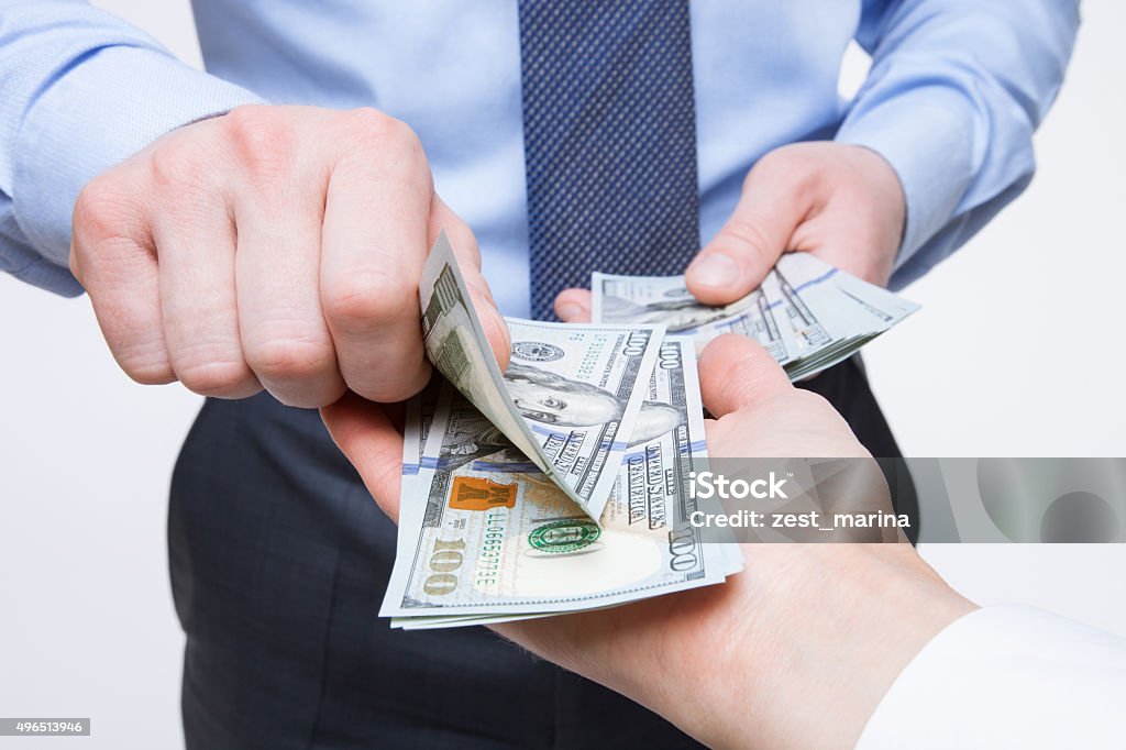 Human hands exchanging money Human hands exchanging money - closeup shot Currency Stock Photo