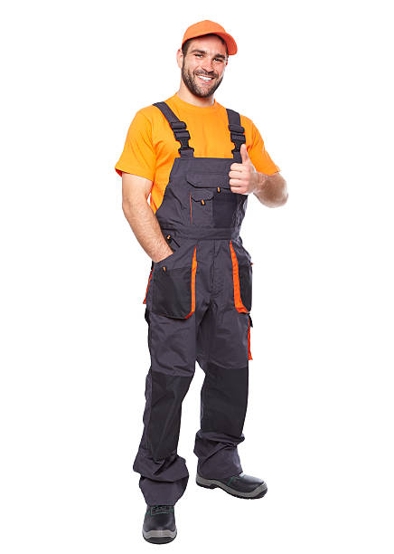 retrato de un trabajador sonriente en traje azul - orange uniform fotografías e imágenes de stock
