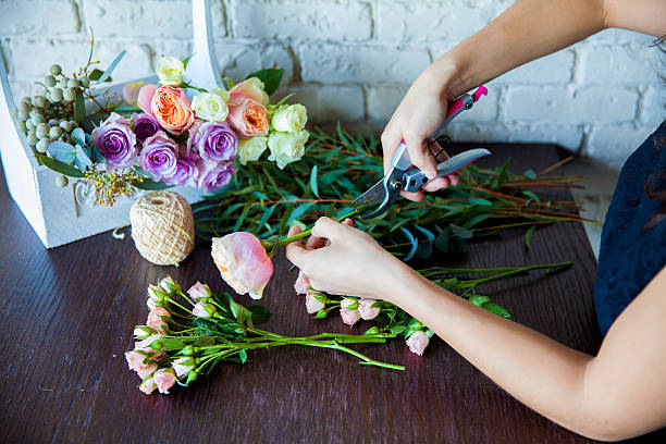 istock Florist at work. Woman making spring floral decorations 496514559