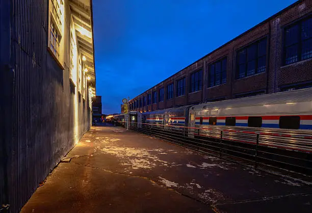 Old Railroad Buildings, Amtrak Train And Platform was taken at the 2014 Streamliners Festival in Spencer, N.C. at twilight.   