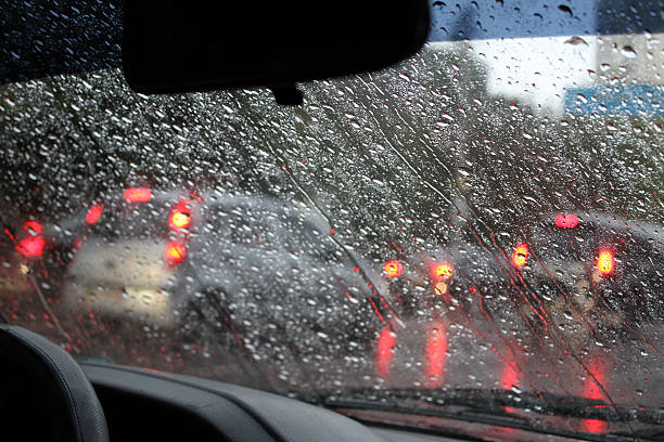 istock Look through drops on windshield at traffic jam in city 496514610