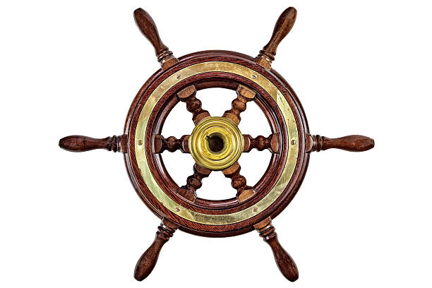 Ship helm and rope on wooden floor