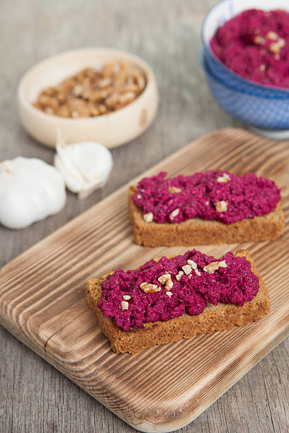 istock Beetroot pesto in a blue bowl on a wooden table 496515518