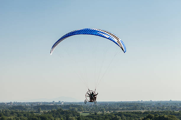istock aerial view of paramotor flying over the fields 496515876