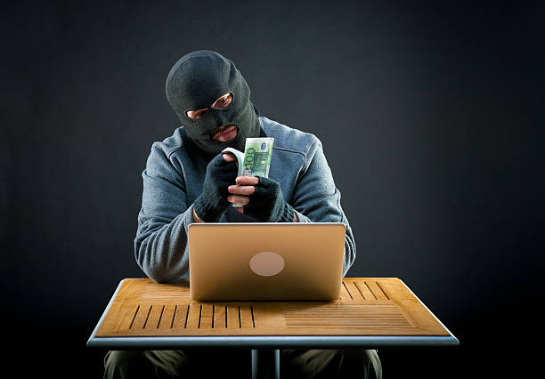 istock Cybercriminal man counts euro 496515944