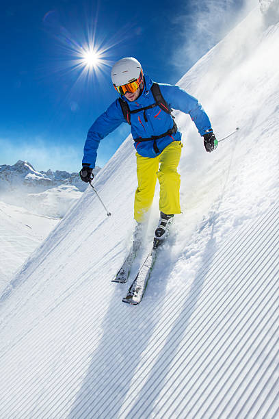 istock Skier skiing downhill in high mountains 496516038