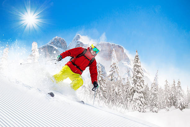 istock Skier skiing downhill in high mountains 496516428