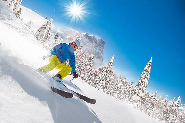 istock Skier skiing downhill in high mountains 496516532