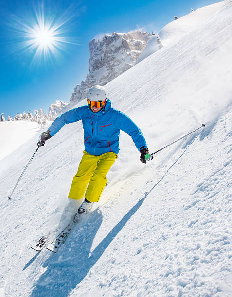 istock Skier skiing downhill in high mountains 496516586