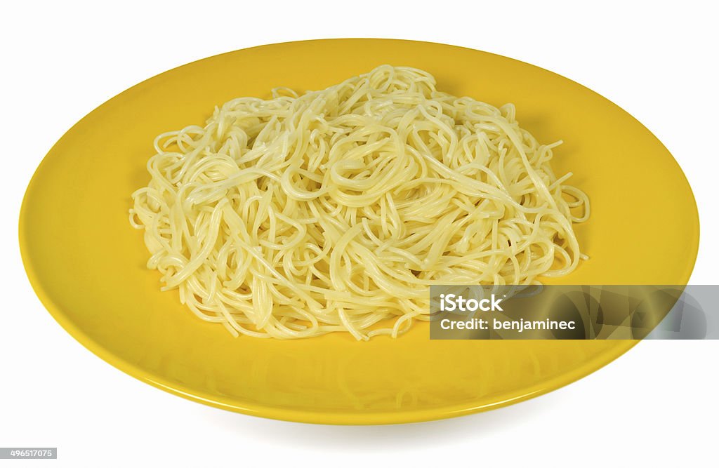 Boiled spaghetti Boiled spaghetti served in a big yellow plate isolated on white background Advice Stock Photo