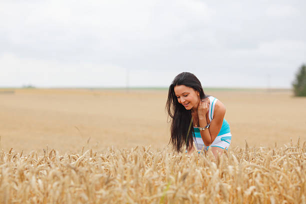 istock woman on wheat field 496518301
