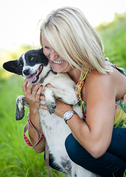 istock Woman playing with dog 496518335