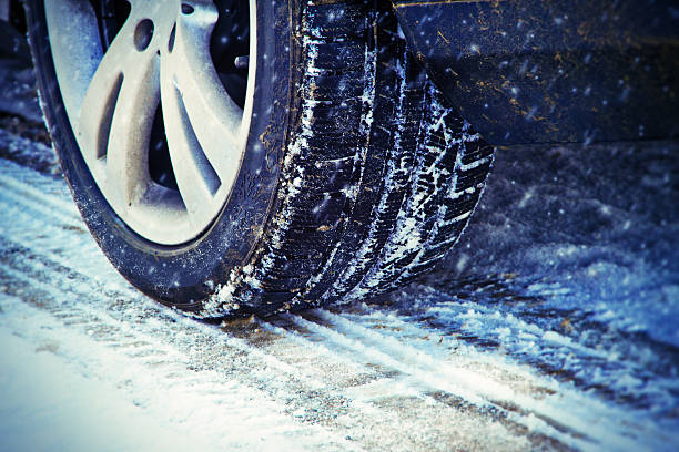 istock Car tire on winter road 496518846