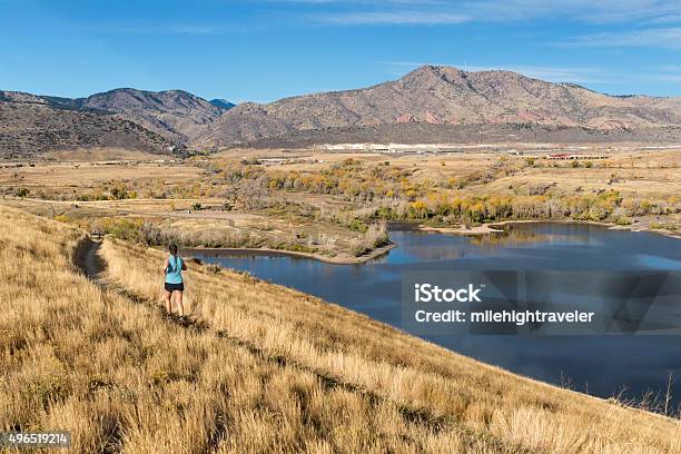 Young Woman Trail Runs Bear Creek Lake Colorado Rocky Mountains Stock Photo - Download Image Now