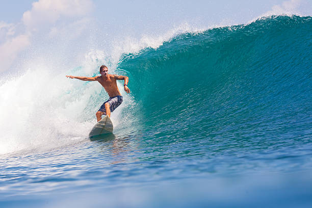 istock Surfing a Wave. Bali Island. Indonesia. 496519455