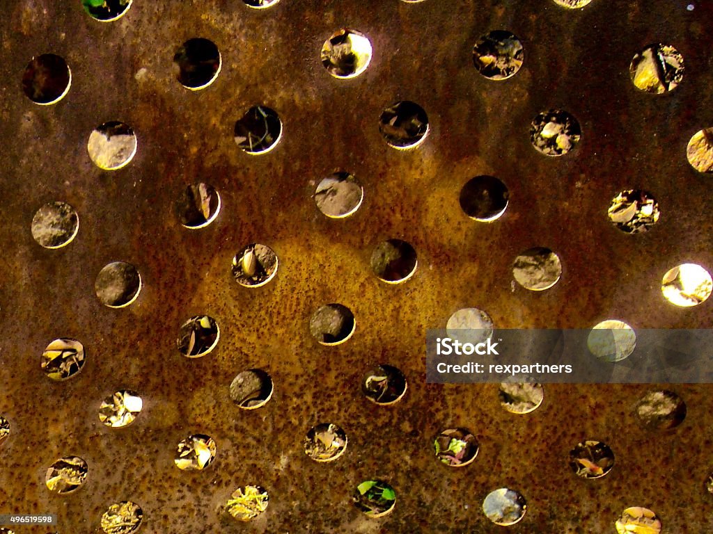 Perforated Rusted Background Abstract with Rusted Metal Gravel Stock Photo