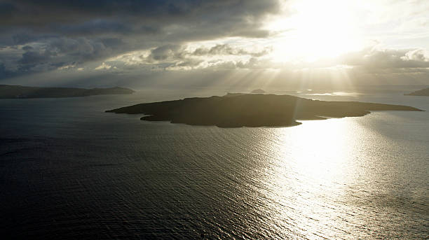 istock sunset over volcanic island in fira greece 496520556