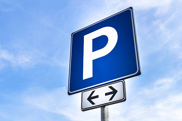 Parking signal Free parking signal, for both street sides, with the empty sky in the background. parking photos stock pictures, royalty-free photos & images