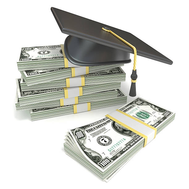 istock Education concept. Graduation cap on stack of dollar bills 496523376
