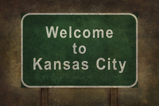 Welcome to Kansas City road sign illustration with distressed ominous background