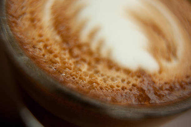 Macro photo of cappuccino coffee drink with foam