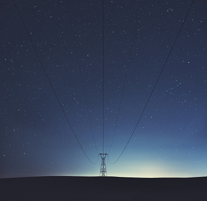 Standing beneath the center of a high voltage transmission line on a beautifully clear November night.  Long exposure.