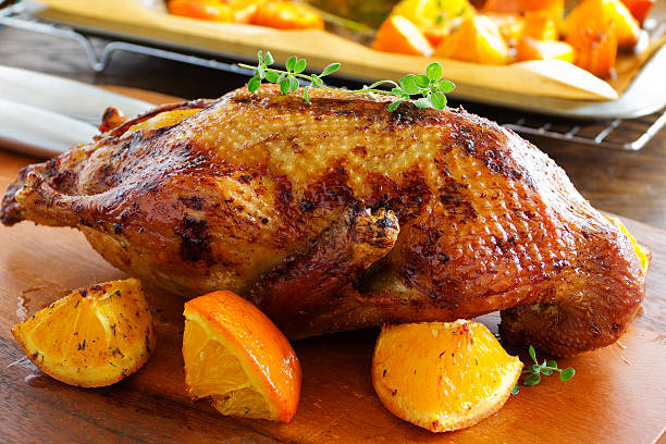 istock Roast duck with pumpkin and oranges. 496547460