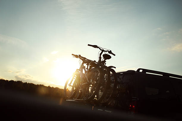 Bike transportation - two bikes on back of a car stock photo