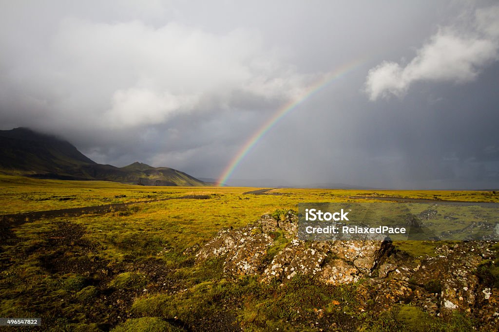 Icelandic Rainbow and Lava Fields A rainbow and icelandic lava fields, covered in moss. 2015 Stock Photo