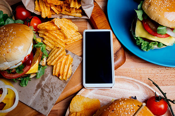istock Hamburgers with moblie phone 496548434
