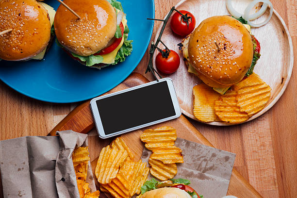 istock Hamburgers with moblie phone 496548456