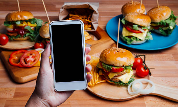 istock Hamburgers with moblie phone 496548518