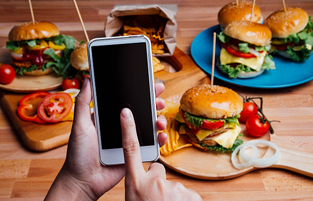 istock Hamburgers with moblie phone 496548536
